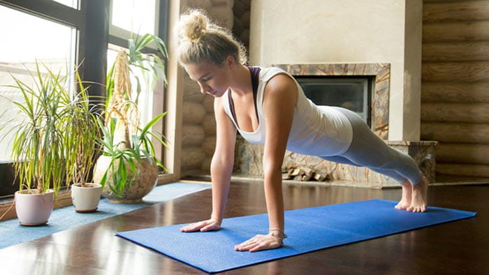 Woman doing yoga at home