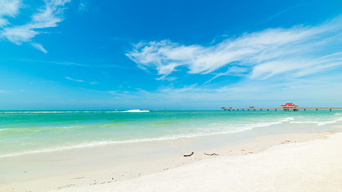 Clear water beach with it's pier in Florida