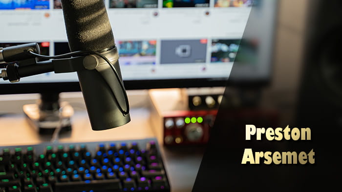 A podcast mic, keyboard, audio DAC, a monitor and Preston Arsemet's name