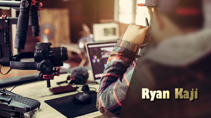 A man editing on a laptop, a drone, a camera on a gimble and Ryan Kaji's name