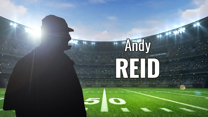 A silhouette representing Andy Reid in a football stadium