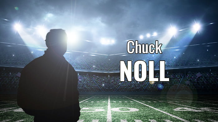 A silhouette representing Chuck Noll in a football stadium