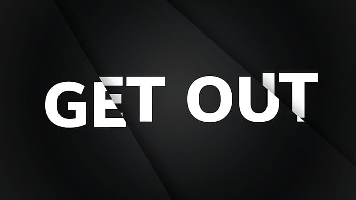 A fractured black background with Get Out written on it