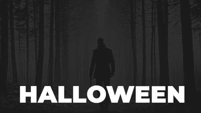 A silhouette of a man in a forest with Halloween written on it