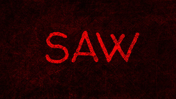 An eerie background with Saw written on it