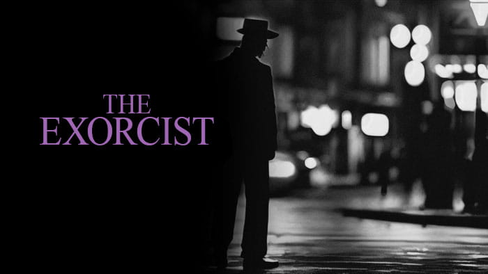 The silhouette of a man standing in the street with the Exorcist written on it