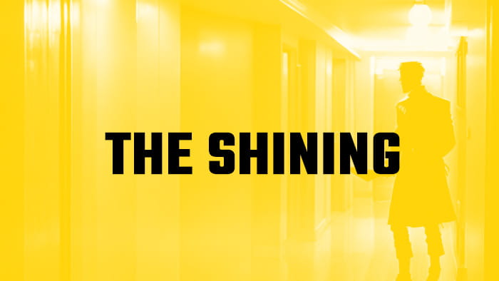 A silhouette of a man in a hallway with the Shining written on it