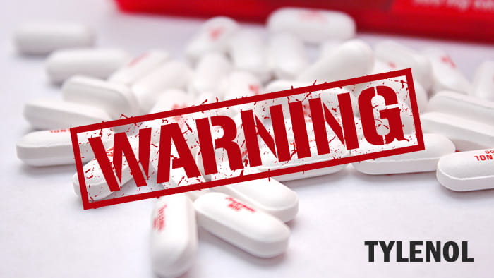 A bottle of Tylenol with a warning label prominently displayed