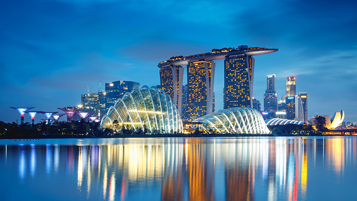 Aerial view of Singapore's dazzling skyline at night.