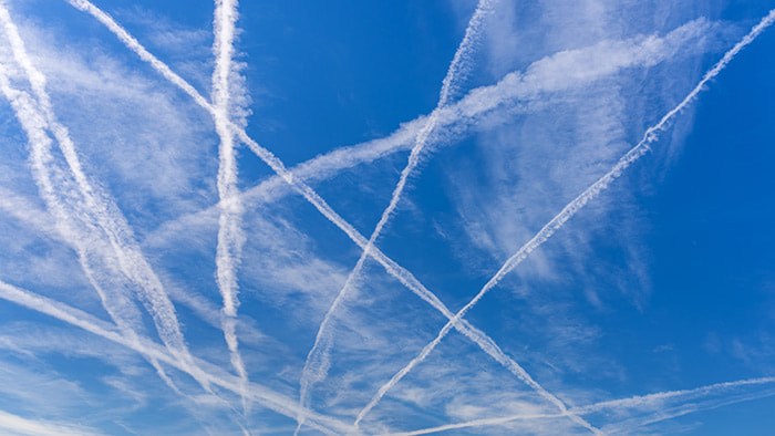 Contrails in the sky, often mistaken for chemtrails by conspiracy theorists