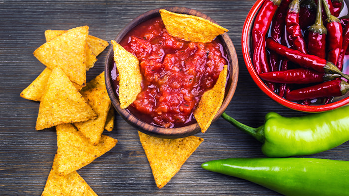 A close-up of Doritos chips showing their bold seasoning and triangular shape