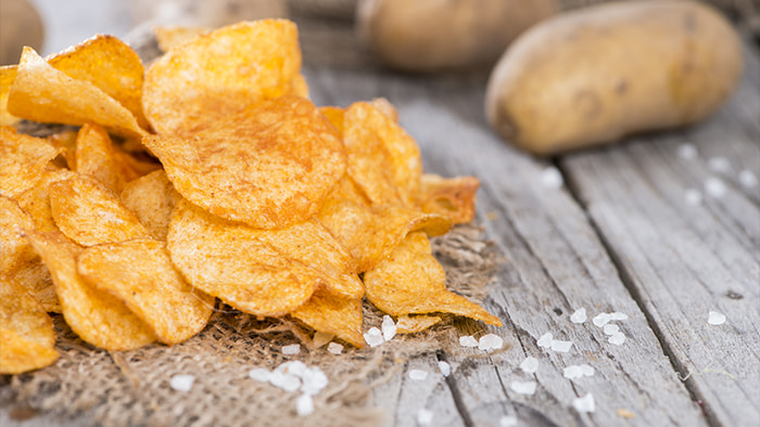 A bowl of crispy golden potato chips