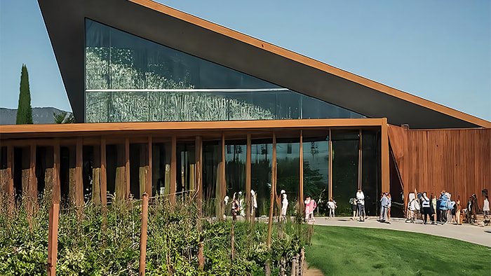 Opus One Winery in Napa Valley with modern architecture and a group of visitors on tour
